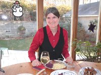 Kirsten has a glass of white wine to it.