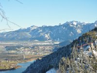 Castle Neuschwanstein is just behind the front mountain, the white tower barely visible.