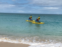 Guards patroling along Grand Anse beach.