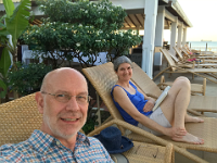 Reading a book at the pool, very relaxed.
