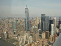 One, Two, and Four World Trade Center, all glass and steel amidst older highrises.