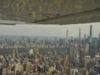 Several matchsticks, all looking down on Central Park.