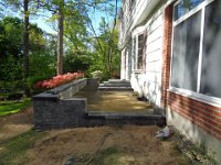 Wall, staircase and patio take shape.