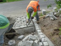 Filling the gaps between the stones looks like work in a bakery.