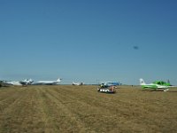 Now, the shuttle is a golf cart, bringing us to our parking spot on the grass.