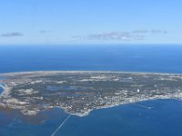 Getting closer, the strip of the airport in the back.