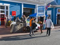A cat and a cowboy with a whip.