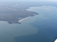 Looks like the green stuff is washed into the sea from the rivers. Agriculture? Fertilizers? For sure, it does not look normal.